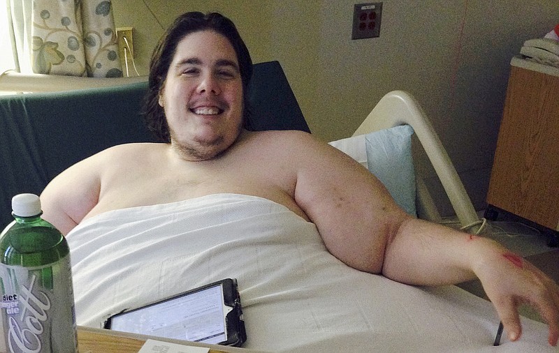 
              In this Monday, Oct. 12, 2015 photo, Steven Assanti, 33, rests in bed at Kent Hospital in Warwick, R.I. Assanti, of Cranston and who weighs nearly 800 pounds, said he was kicked out of another hospital for ordering pizza. Assanti said he is determined to slim down and hopes to eventually drop to 180 pounds. He said a surgeon read about him and offered to fly him to Texas to help him lose weight so he can have gastric bypass surgery. (AP Photo/Jennifer McDermott)
            