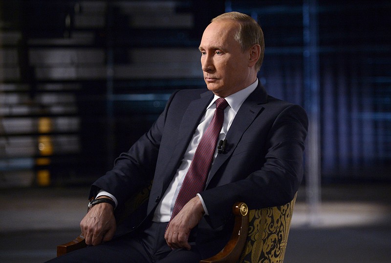 
              In this Saturday, Oct. 10, 2015 photo provided on Monday, Oct. 12, 2015, Russian President Vladimir Putin give an interview focused on Russia's action in Syria, to Russian TV Rossya-1 channel in Sochi, Russia. (Alexei Nikolsky/RIA-Novosti, Kremlin Pool Photo via AP)
            