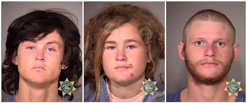 
              Multnomah County Sheriff's Office photos show the three suspects who were arrested Wednesday, Oct. 7, 2015, in Portland, Ore., in the killing of Steve Carter, a tantra yoga teacher, on a hiking trail in Marin County, Calif. From left are Sean Michael Angold, 24; Lila Scott Allgood, 19; and Morrison Haze Lampley, 23. A hiker found Carter's body on Monday. (Multnomah County Sheriff's Office/Portland police via AP)
            
