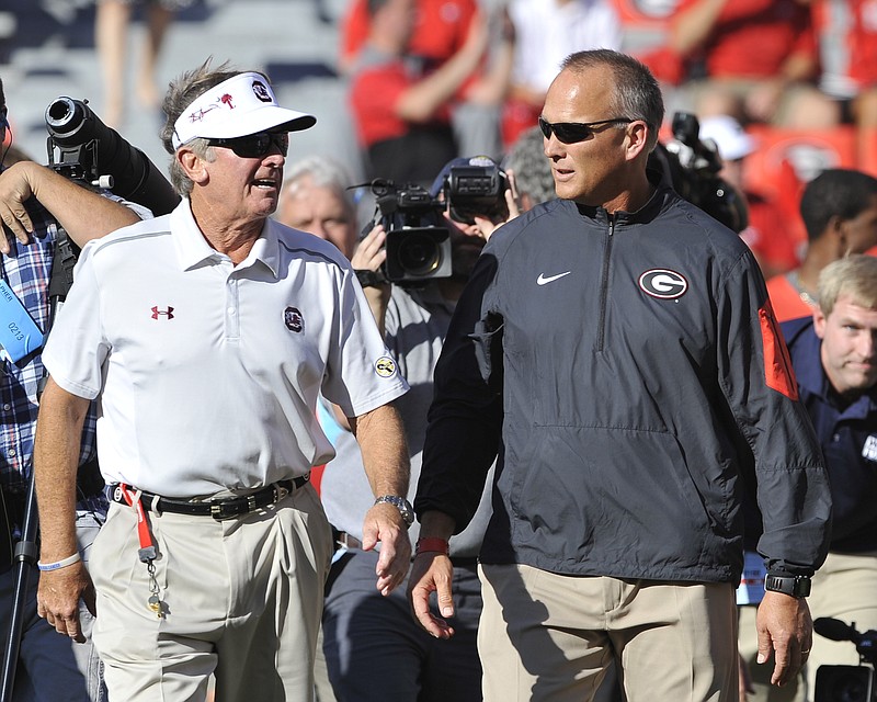 Former South Carolina football coach Steve Spurrier and Georgia coach Mark Richt visit before last month's game in Athens, which the Bulldogs won 52-20.