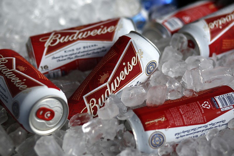 
              FILE - In this Thursday, March 5, 2015 file photo, Budweiser beer cans at a concession stand at McKechnie Field in Bradenton, Florida, USA.  Budweiser brewer Anheuser-Busch InBev has raised its takeover bid for SABMiller to 70.4 billion pounds ($108.2 billion) Monday, Oct. 12, 2015 in its latest effort to win backing for its plan to create “the first truly global beer company.” (AP Photo/Gene J. Puskar, File)
            
