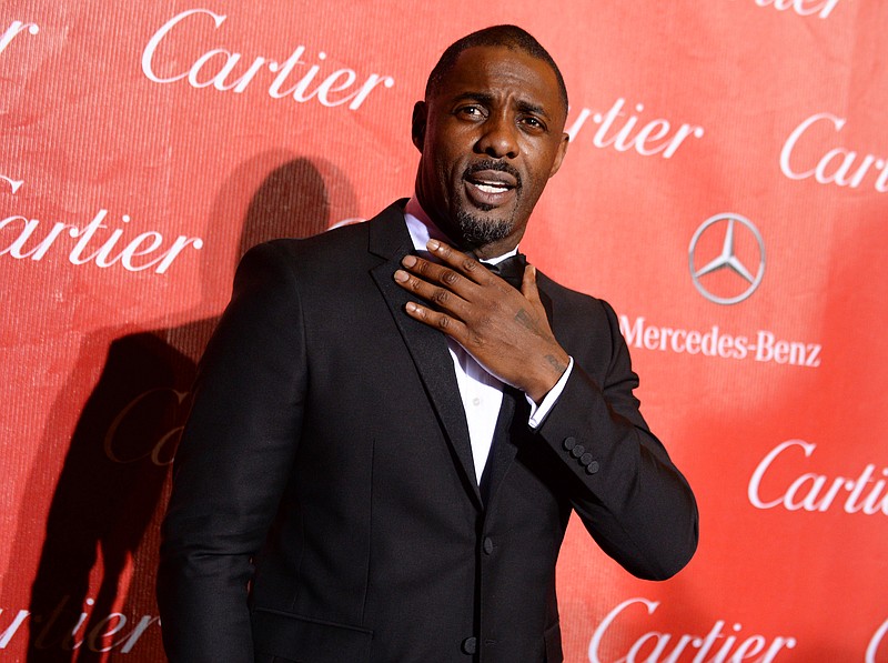 
              FILE- In this Jan. 4, 2014 file photo, Idris Elba arrives at the Palm Springs International Film Festival Awards Gala in Palm Springs, Calif. The spring exhibition at the Metropolitan Museum of Art's Costume Institute will focus on technology's impact on fashion, and the May 2, 2016 gala benefiting the institute will be co-chaired by Elba, Apple's chief design officer, Jonathan Ive, Taylor Swift and Anna Wintour. (Photo by Jordan Strauss/Invision/AP, File)
            