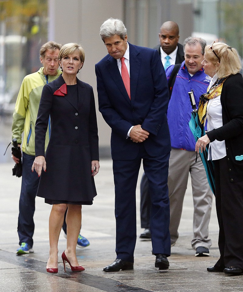 
              Secretary of State John Kerry, center, and Australian Foreign Minister Julie Bishop, second from left, stand at the site of the Boston Marathon bombings, Tuesday, Oct. 13, 2015, in Boston. Kerry and Secretary of Defense Ash Carter are meeting with their Australian counterparts in Boston to discuss security and trade issues. (AP Photo/Michael Dwyer)
            