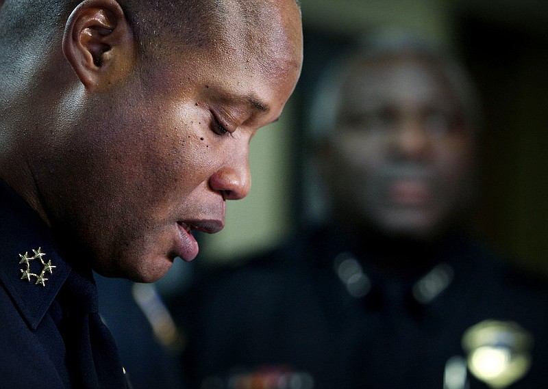 Memphis Police Director Toney Armstrong provides additional information about the shooting death of off duty officer Terence Olridge during a news conferene, Tuesday, Oct. 13, 2015, in Memphis. The off-duty officer was not taking "official police action" when he was killed in a shootout with a neighbor, and there is not enough evidence to charge the neighbor Lorenzo Clark with murder, a police chief said Tuesday.