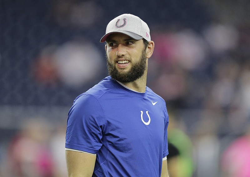 
              Indianapolis Colts' Andrew Luck watches his teammates warm up before an NFL football game against the Houston Texans, Thursday, Oct. 8, 2015, in Houston. Luck will miss the game with an injury. (AP Photo/Patric Schneider)
            