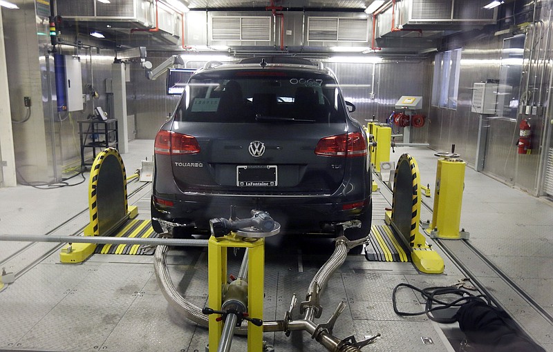 A Volkswagen Touareg diesel is tested in the Environmental Protection Agency's cold temperature test facility, Tuesday, Oct. 13, 2015, in Ann Arbor, Mich. Volkswagen has disclosed to U.S. regulators that there's additional suspect software in its 2016 diesel models that would potentially help their exhaust systems run cleaner during government tests.