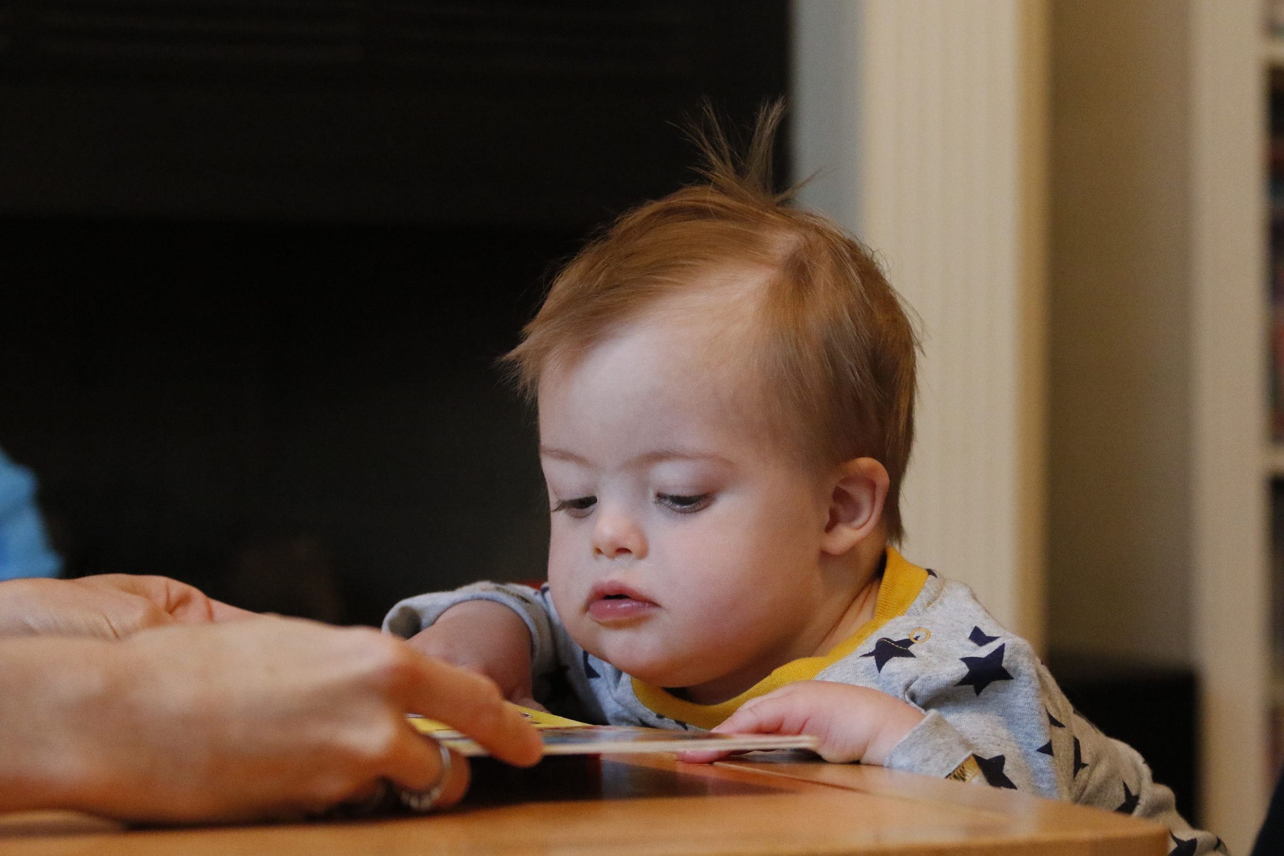 Staff Photo by Dan Henry / The Chattanooga Times Free Press- 10/8/15. Nineteen-month-old Maverick Cochran works with physical therapist Kilbrey Fowler at the Cochran residence to build Maverick's leg and trunk strength on Thursday, October 8, 2015. Maverick was diagnosed with Down Syndrome months after he was born.