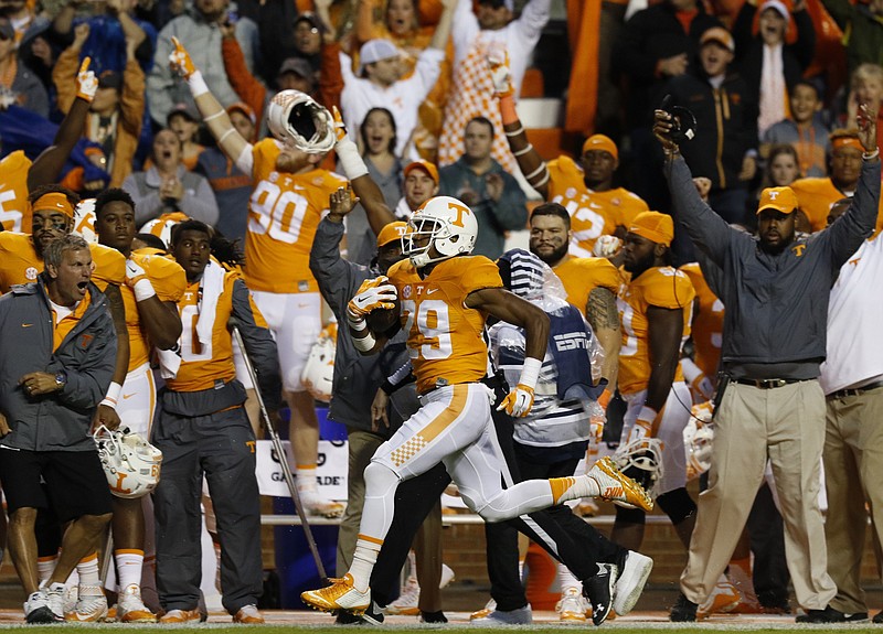 Staff Photo by Dan Henry / The Chattanooga Times Free Press- 10/3/15. UT's Evan Bery (29) returns Arkansas's kickoff 96-yards for a touchdown during the first quarter of play on October 3, 2015. The Volunteers played the Razorbacks at home in Neyland Stadium late Saturday evening. 