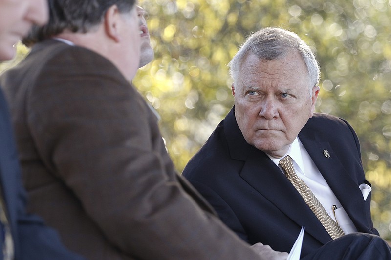 Staff Photo by Dan Henry / The Chattanooga Times Free Press- 10/15/15. Georgia Governor Nathan Deal converses with Senator Jeff Mullis before speaking on Thursday, October 15, 2015 to officials who gathered on the new Vanguard site in Trenton for an announcement that the Semi-trailer manufacturing plant is bringing 400 jobs to Dade County.