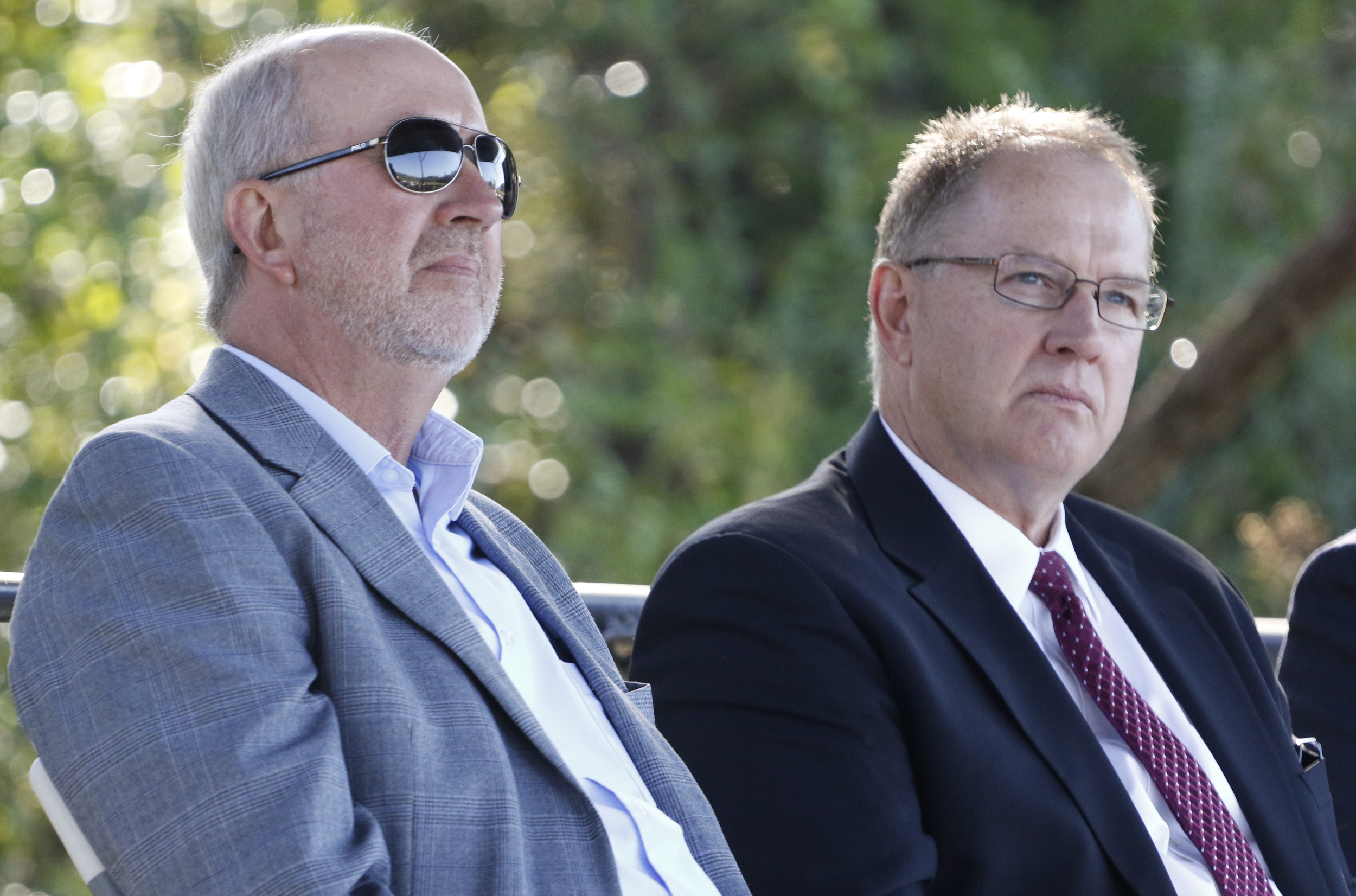 Staff Photo by Dan Henry / The Chattanooga Times Free Press- 10/15/15. Denny Williams COO of Vanguard, left, and Charles Mudd, President and CEO of Vanguard, listen as Georgia Governor Nathan Deal speaks on Thursday, October 15, 2015 to officials and guests gathered on the new Vanguard site in Trenton for an announcement that the Semi-trailer manufacturing plant is bringing 400 jobs to Dade County.
