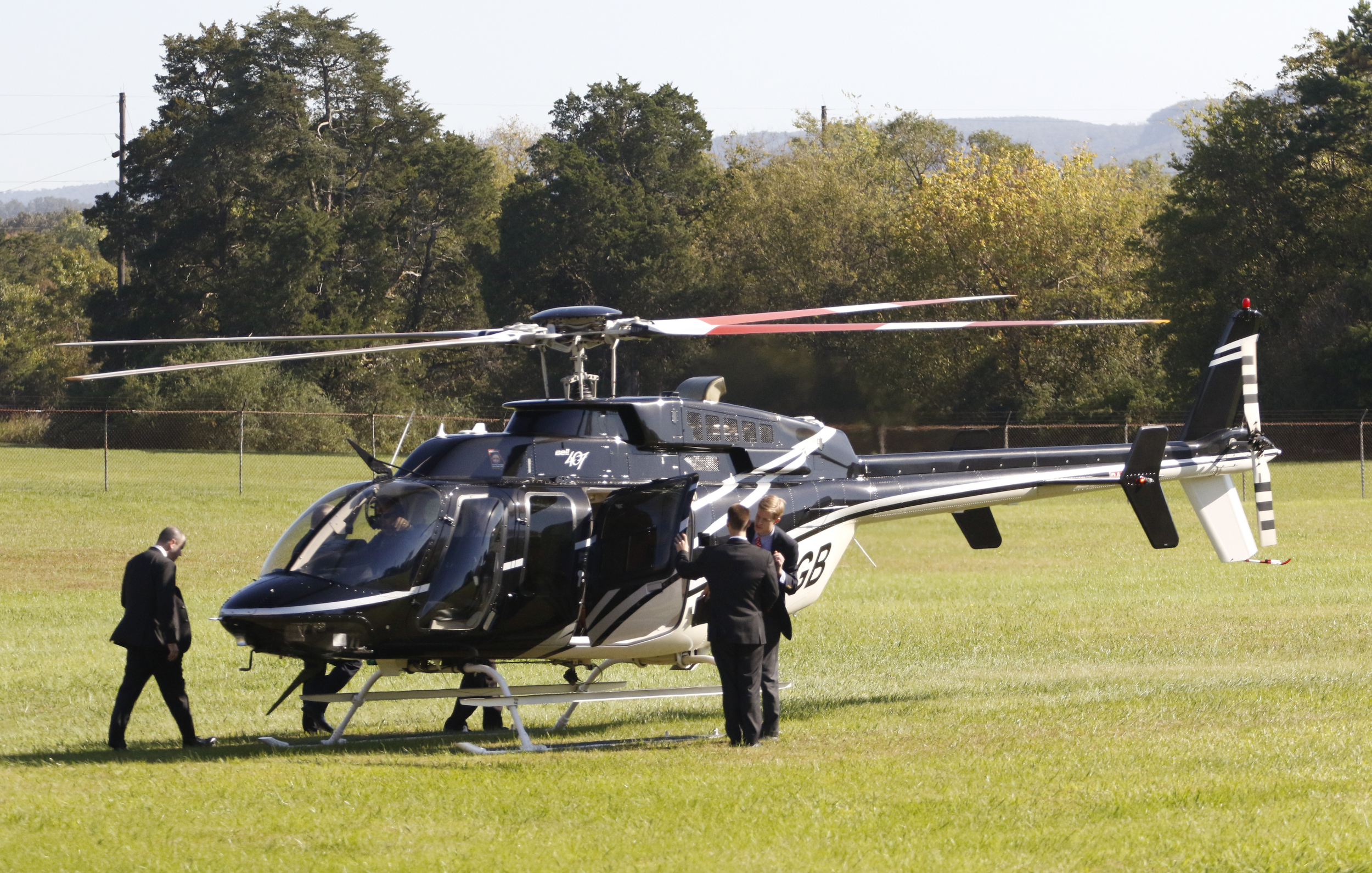 Staff Photo by Dan Henry / The Chattanooga Times Free Press- 10/15/15. Georgia Governor Nathan Deal boards a helicopter after speaking on Thursday, October 15, 2015 to officials and guests on the new Vanguard site in Trenton during an announcement that the Semi-trailer manufacturing plant is bringing 400 jobs to Dade County.