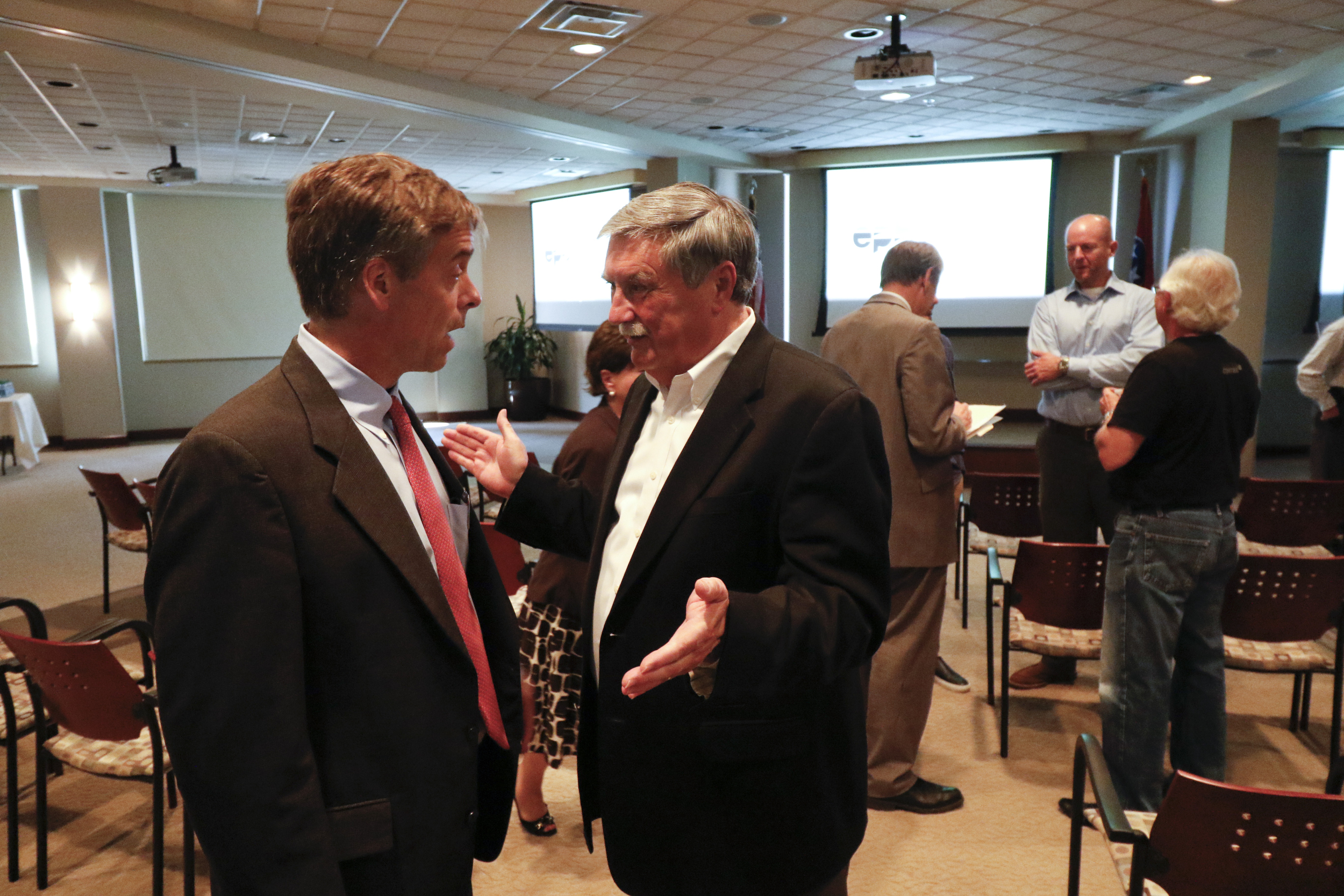 Staff Photo by Dan Henry / The Chattanooga Times Free Press- 10/15/15. Charlie Brock, President/CEO of Launch, left, speaks to Harold dePriest president/CEO of EPB, after a press conference announcing that residents of the Tennessee valley will have the opportunity to have the worlds fastest home 10-gig internet service.