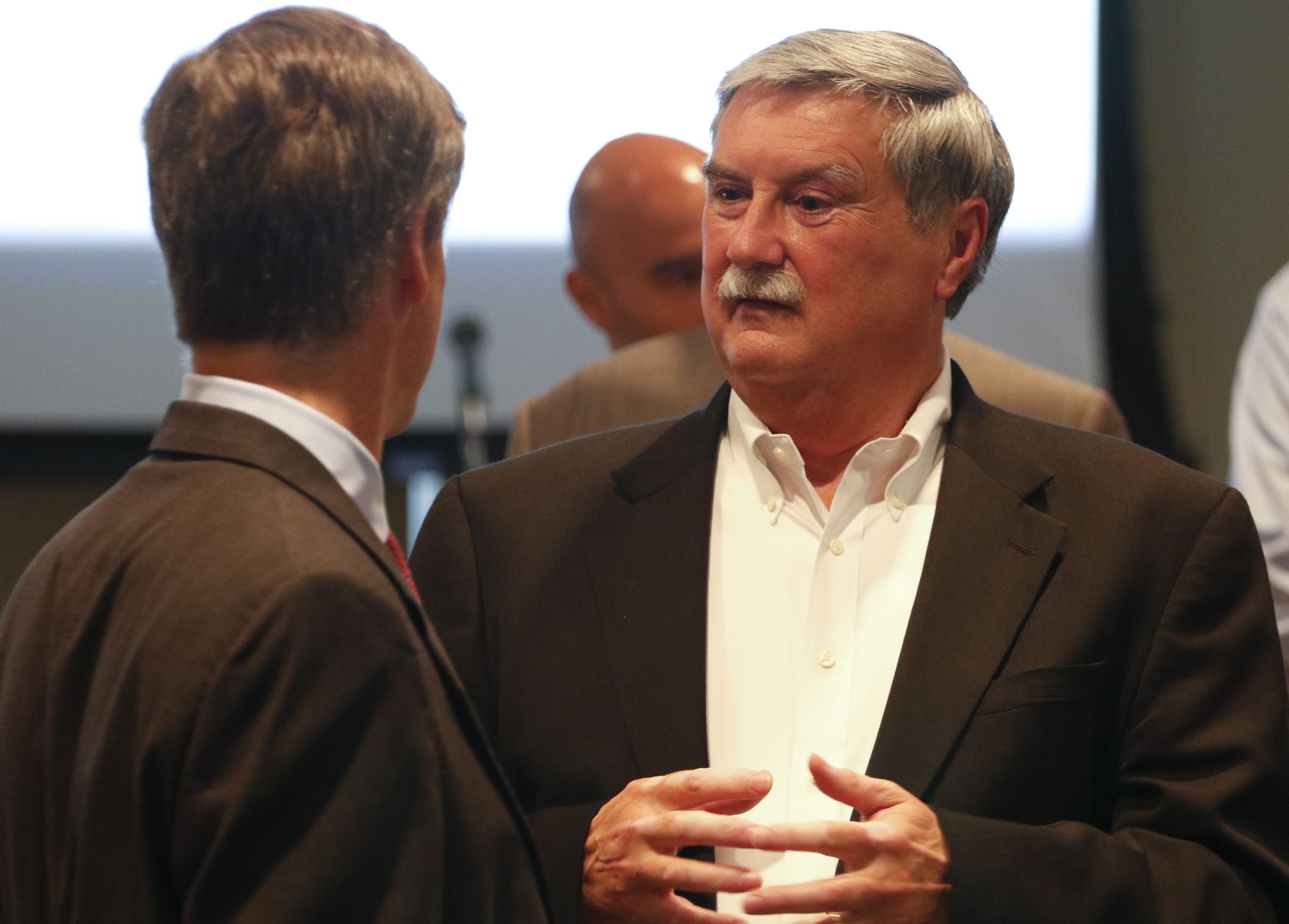 Staff Photo by Dan Henry / The Chattanooga Times Free Press- 10/15/15. Charlie Brock, President/CEO of Launch, left, speaks to Harold dePriest president/CEO of EPB, after a press conference announcing that residents of the Tennessee valley will have the opportunity to have the worlds fastest home 10-gig internet service.