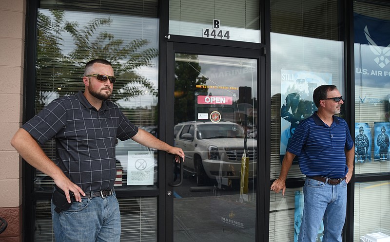 Nathan Bell, left, and Sen. Mike Bell, R-Riceville stand outside of the Armed Forces Career Center in Cleveland, Tenn, on July 23.