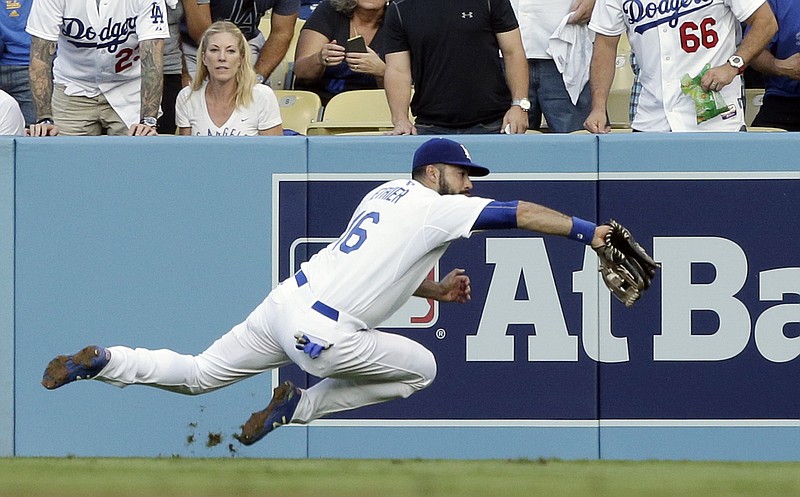 
              Los Angeles Dodgers right fielder Andre Ethier catches a ball hit by the New York Mets' Michael Conforto during the second inning in Game 5 of baseball's National League Division Series Thursday, Oct. 15, 2015, in Los Angeles. (AP Photo/Alex Gallardo)
            