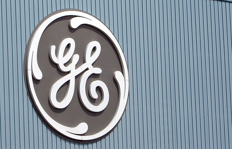 
              FILE - In this Tuesday, June 24, 2014 file photo, the General Electric logo is seen at a plant in Belfort, eastern France.  General Electric Co. on Friday, Oct. 16, 2015 reported a decline in third-quarter profit, but strong performances from its core units helped the company top Wall Street expectations.  (AP Photo/Thibault Camus, File)
            
