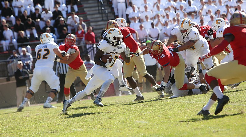 UTC's Richardre Bagley runs for the Mocs in Saturday's 33-27 win at VMI.