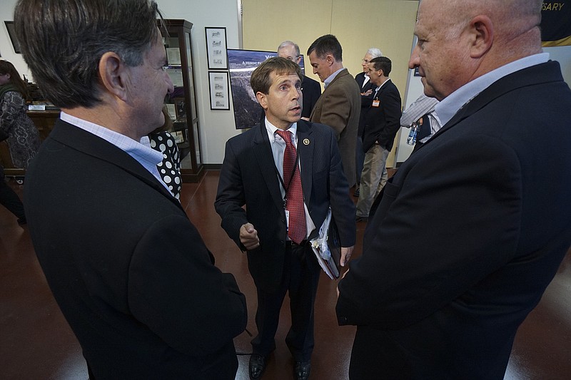 Congressman Chuck Fleischmann mingles with professionals from Chattanooga as they tour the Y-12 facility in Oak Ridge, Tenn., on Wednesday, Oct. 14, 2015.