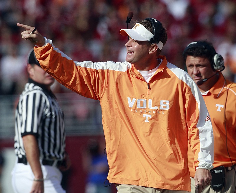 Tennessee coach Lane Kiffin yells instructions to his players during the first half of an NCAA college football game against top-ranked Alabama at Bryant-Denny Stadium in Tuscaloosa, Ala., Saturday, Oct. 17, 2009.