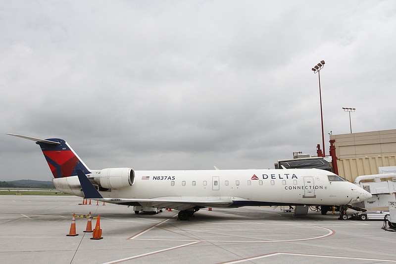 Staff Photo by Dan Henry / The Chattanooga Times Free Press- 6/24/14. A Delta flight destined for Atlanta docks at the newly renovated CHA Chattanooga Metropolitan Airport.