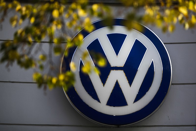 
              FILE - This Oct. 5, 2015 file photo shows the Volkswagen logo at the building of a company retailer in Berlin, Germany. Volkswagen almost inevitably will have to compensate owners of diesel cars equipped with emissions-rigging software. Some legal experts say the automaker could be forced to buy back the cars altogether. (AP Photo/Markus Schreiber, File)
            