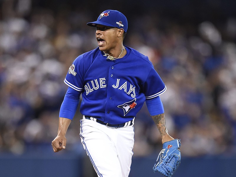 Toronto Blue Jays starting pitcher Marcus Stroman reacts after a pitch against the Kansas City Royals during the sixth inning in Game 3 of baseball's American League Championship Series on Monday, Oct. 19, 2015, in Toronto.