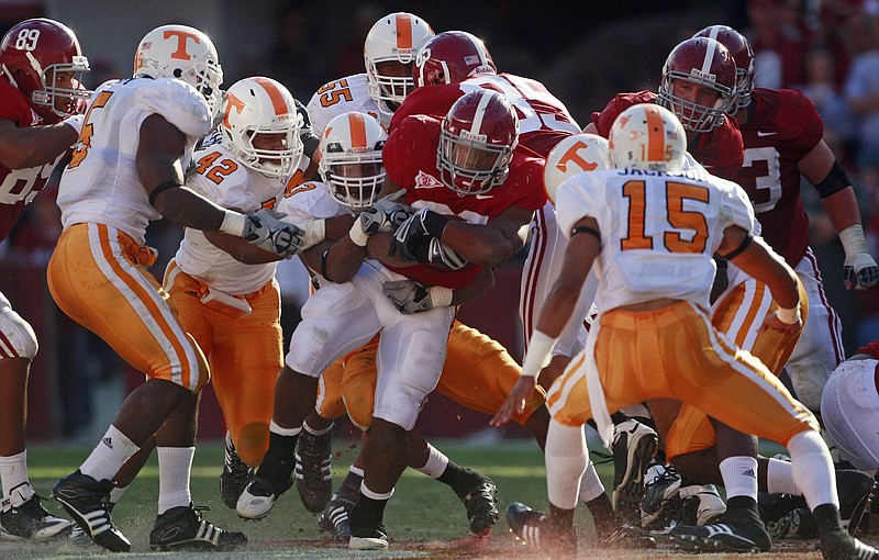 Members of the Tennessee defense stop Alabama running back Mark Ingram (22) in the first half of their NCAA college football game at Bryant-Denny Stadium in Tuscaloosa, Ala., Saturday, Oct. 24, 2009.