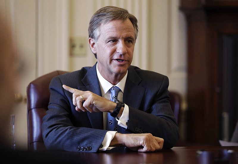FILE - In this March 27, 2013 file photo, Tennessee Gov. Bill Haslam answers a question during a news conference after speaking to a joint session of the Legislature in Nashville, Tenn. The federal investigation into the truck stop chain owned by the family of Haslam and his brother, Cleveland Browns owner Jimmy Haslam, led to its first convictions this week and threatens to widen against employees at Pilot Flying J. (AP Photo/Mark Humphrey, File)