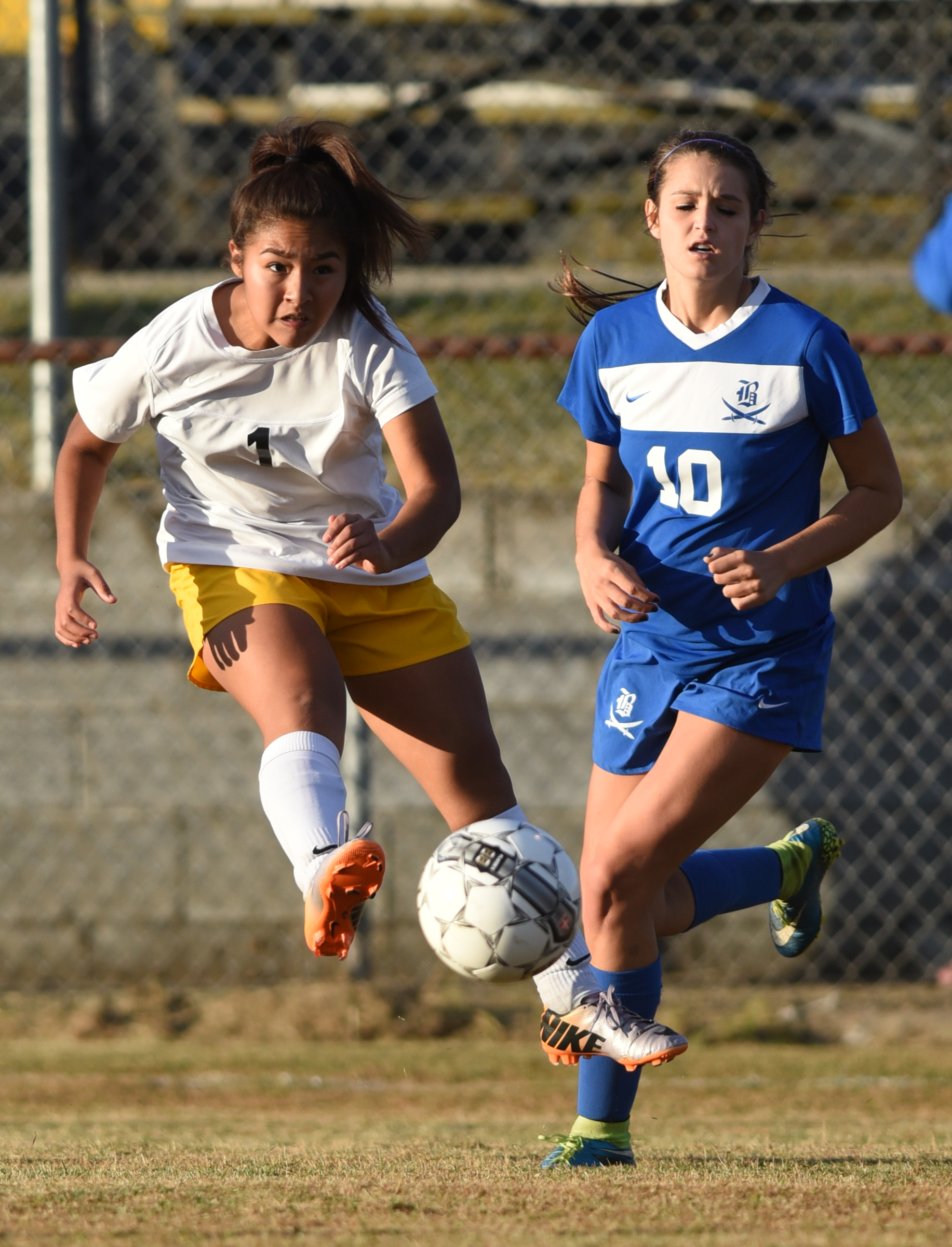 Hixson's Karime Arriaga kicks the ball as Boyd Buchanan's Logan pursues Tuesday, October 20, 2015 at Hixson High School.