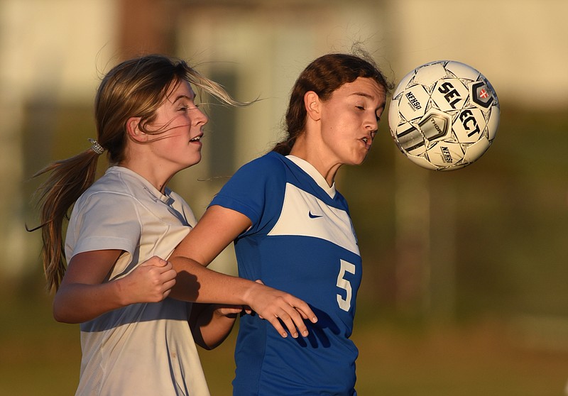 Boyd Buchanan's Emily Hauke and Hixson's Savannah Keef play in the game Tuesday, October 20, 2015 at Hixson High School.