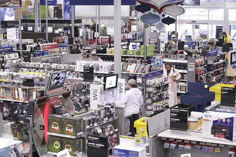 Customers shop in the Hixson Best Buy store in this file photo.