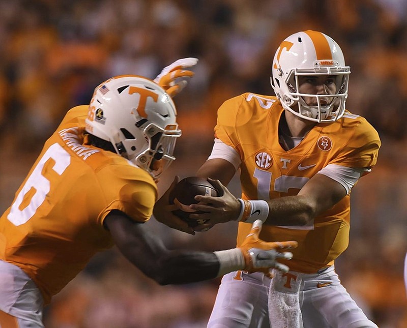Tennessee running back Alvin Kamara prepares to take a handoff from quarterback Quinten Dormady during the Volunteers' rout of Western Carolina last month at Neyland Stadium. Kamara, who began his college career at the University of Alabama, returns to Tuscaloosa this weekend as a member of the opposing team.