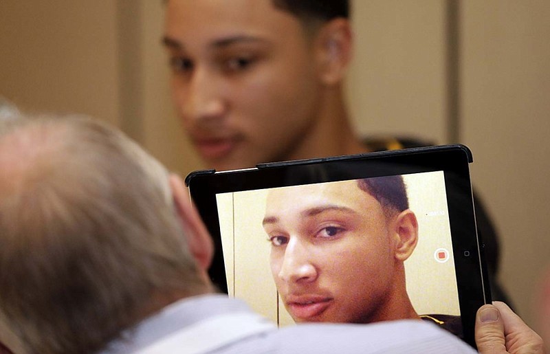 LSU freshman Ben Simmons answers a question during media day for Southeastern Conference men's basketball Wednesday in Charlotte, N.C. SEC media selected Simmons as the league's preseason player of the year.