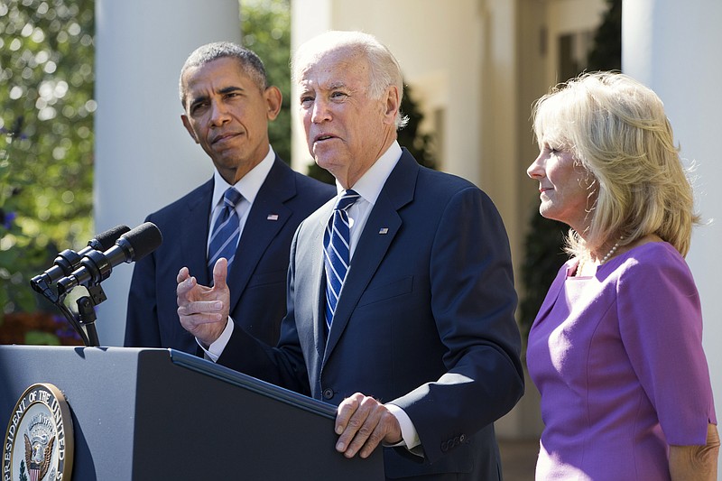 Vice President Joe Biden, with his wife Dr. Jill Biden, right, and President Barack Obama announces that he will not run for the presidential nomination, Wednesday, Oct. 21, 2015, in the Rose Garden of the White House in Washington.