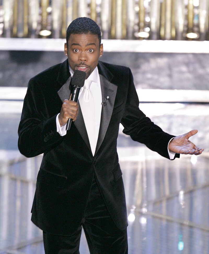 
              FILE - In this Feb. 27, 2005 file photo, Chris Rock hosts the 77th Academy Awards telecast in Los Angeles. Rock will return to host the Oscars for a second time. The show’s producers say the prolific comedian-filmmaker will be at the helm for the 88th Academy Awards next February 28. (AP Photo/Mark J. Terrill)
            