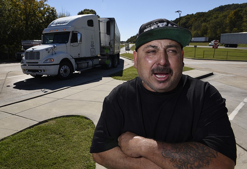 Robert Perez, a long-haul trucker from McAllen, Tex., talks about the profession as he stops at the I-24 rest area west of downtown on Monday, Oct. 19, 2015, in Chattanooga, Tenn. 