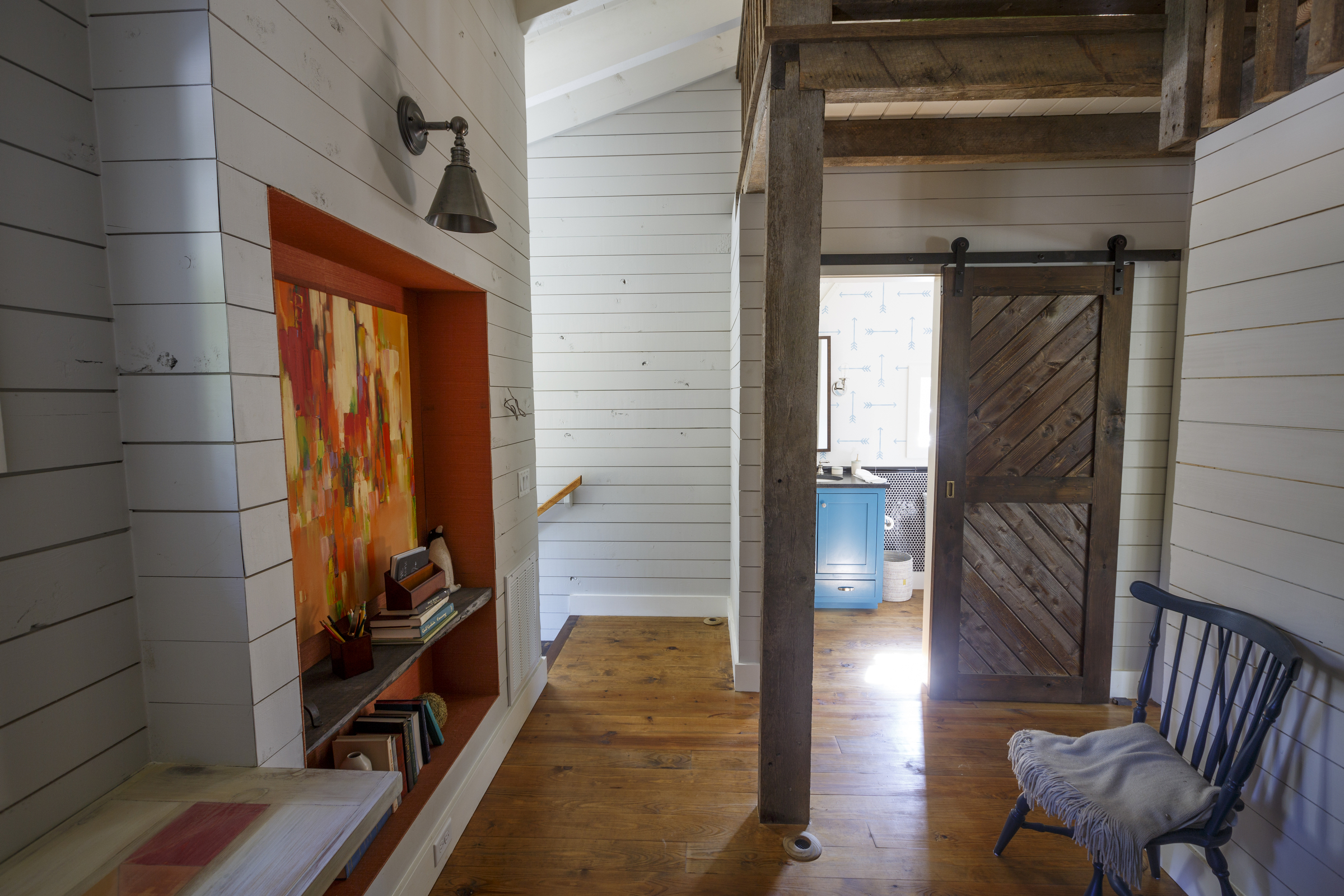 The upstairs atrium with loft and in-wall bookcase of a cottage house in Cloudland Station are seen Friday, Oct. 16, 2015, in Chickamauga, Ga. The cottage is being featured in the television show "This Old House."