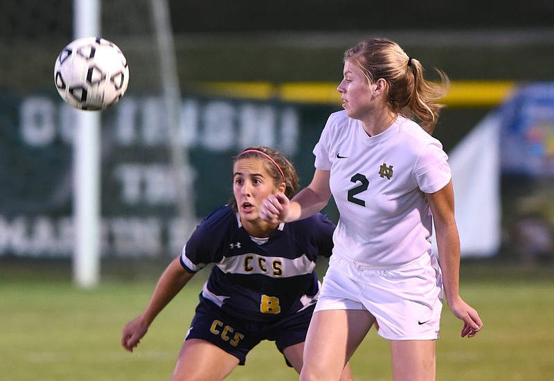 Chattanooga Christian School's Jenna Rogers and Notre Dame's Emma Higgins keep their eyes on the ball Thursday, October 22, 2015, at Notre Dame High School.