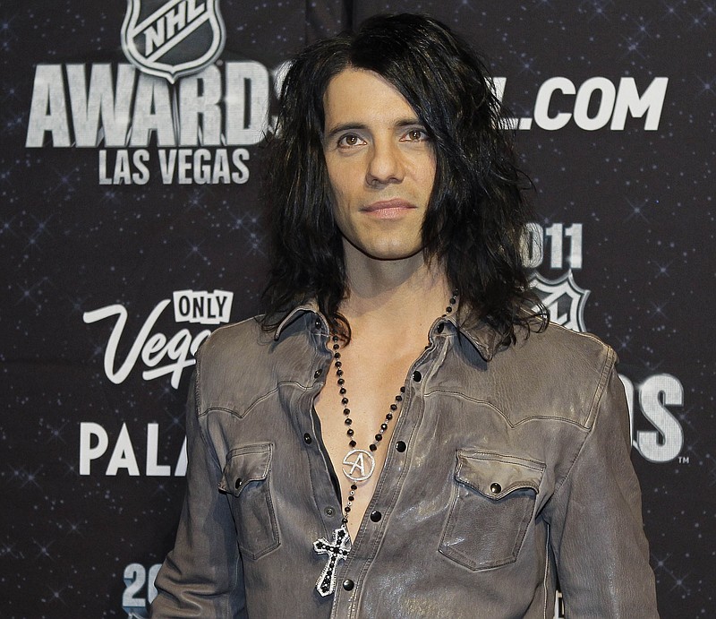 
              FILE - In this June 22, 2011 file photo, Criss Angel appears on the red carpet before the 2011 NHL Awards, in Las Vegas. The Las Vegas magician, Angel, who stars in "Criss Angel BeLIEve" by Cirque Du Soleil at the Luxor casino-hotel, says he's canceling shows for the first time in seven years to visit his young son who was recently diagnosed with leukemia. A statement released Friday, Oct. 23, 2015, said Angel was canceling his shows beginning that night through Nov. 1 to be with his nearly 2-year-old son, Johnny Crisstopher Sarantakos, in Australia. (AP Photo/Julie Jacobson, File)
            