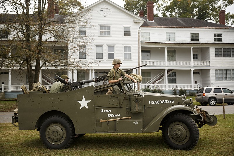 Re-enactors drive a M3A1 scout car at the 6th Cavalry Museum's 6th annual Remembering Our Heroes event on Saturday, Oct. 24, 2015, in Fort Oglethorpe, Ga. The event featured one World War II battle re-enactment, but the second re-enactment was changed to a firing demonstration after lower spectator turnout.