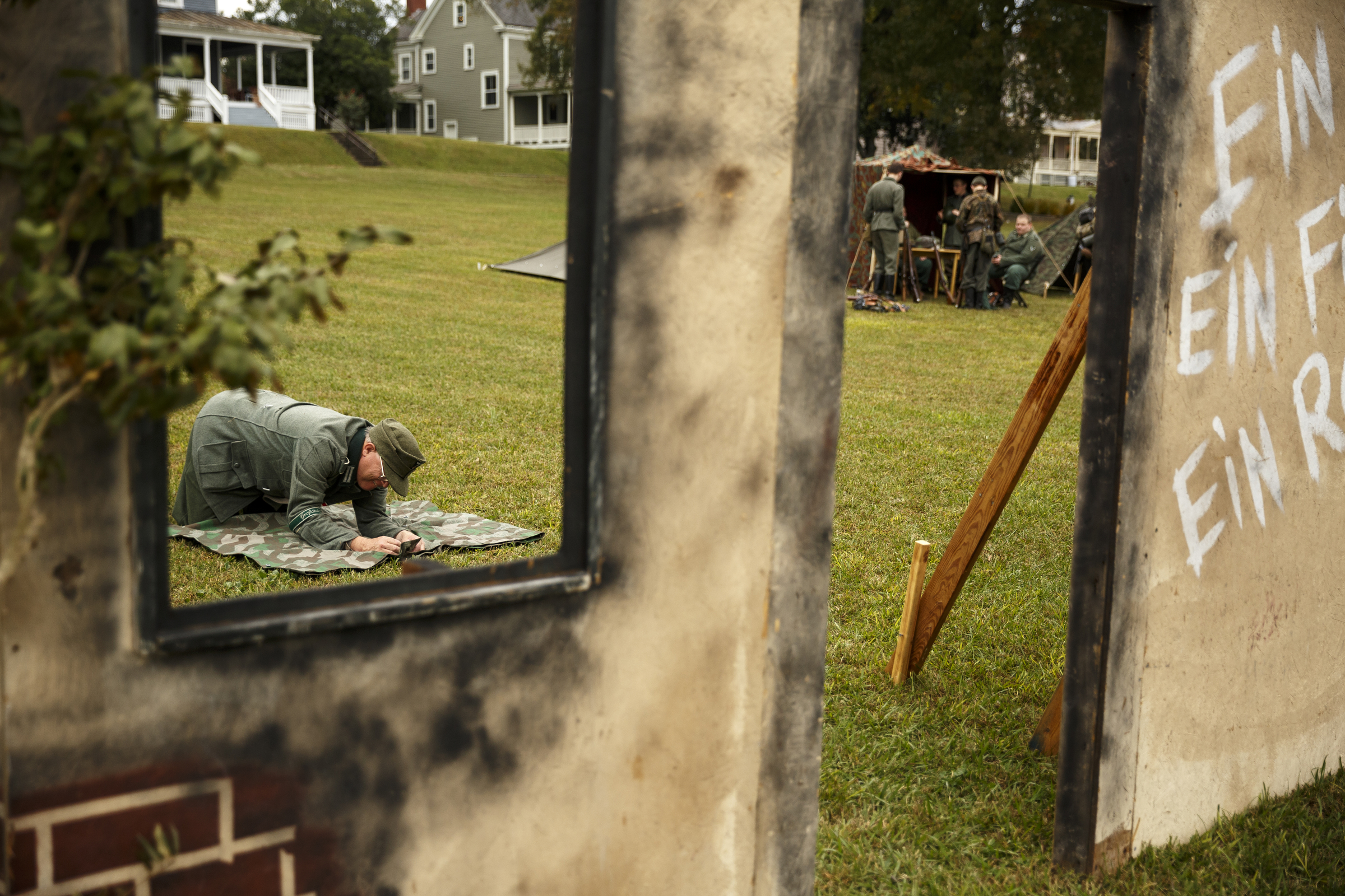 Robert Smith folds a zelt, a german tent, near temporary scenery placed for a re-enactment at the 6th Cavalry Museum's 6th annual Remembering Our Heroes event on Saturday, Oct. 24, 2015, in Fort Oglethorpe, Ga. The event featured one World War II battle re-enactment, but the second re-enactment was changed to a firing demonstration after lower spectator turnout.