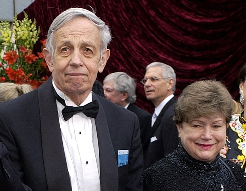 
              FILE - In this March 24, 2002 file photo, John Nash, left, and his wife Alicia, arrive at the 74th annual Academy Awards, in Los Angeles. Princeton University said farewell to the late John Nash, the Nobel Prize-winning mathematician whose struggle with schizophrenia was chronicled in the 2001 movie "A Beautiful Mind,” with a day of remembrance events and a panel discussion about him on Saturday, Oct. 24, 2015. (AP Photo/Laura Rauch, File)
            