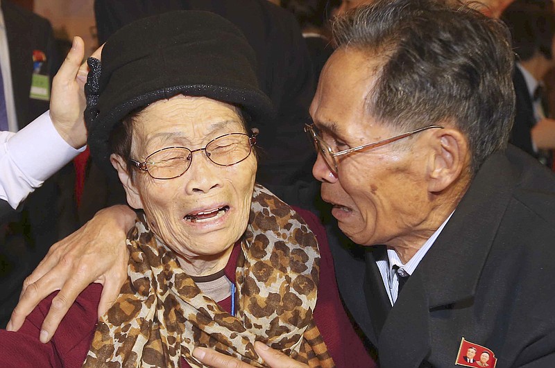 
              South Korean mother Kim Wol-soon, 93, weeps with her North Korean son Ju Jae Un, 72, during the Separated Family Reunion Meeting at the Diamond Mountain resort in North Korea, Saturday, Oct. 24, 2015. Hundreds of South Koreans began meetings with their relatives in North Korea on Saturday in the second and final reunions of families separated by the 1950-53 Korean War. (Kim Do-hoon/Yonhap via AP) KOREA OUT
            