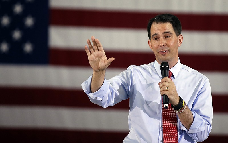 
              FILE - In this Sept. 14, 2015, file photo, Republican presidential candidate Wisconsin Gov. Scott Walker speaks during a town hall meeting in Las Vegas. Wisconsin Republicans are moving at breakneck speed to abolish secret investigations into political corruption such as one that haunted Walker, do away with the state’s unique nonpartisan elections board and legalize coordination between candidates and shadowy issue advocacy groups that don't disclose their donors. (AP Photo/Isaac Brekken, File)
            