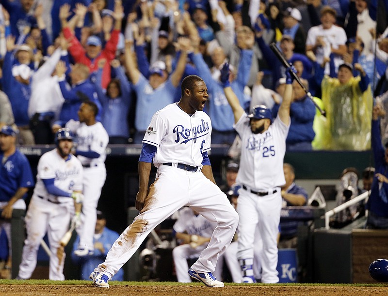 Kansas City Royals' Lorenzo Cain celebrates after scoring on a hit by Eric Hosmer against the Toronto Blue Jays during the eight inning in Game 6 of baseball's American League Championship Series on Friday, Oct. 23, 2015, in Kansas City, Mo.