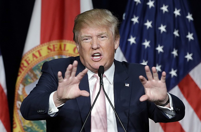 
              Republican presidential candidate Donald Trump gestures as he addresses supporters during a campaign stop at the Trump National Doral Miami resort, Friday, Oct. 23, 2015 in Doral, Fla.. (AP Photo/Alan Diaz)
            