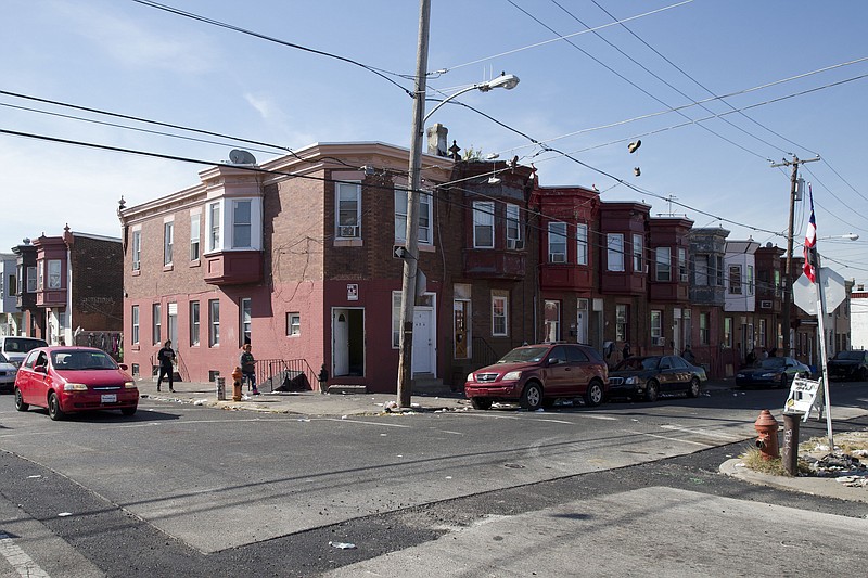 In this Wednesday, Oct. 21, 2015, photo, the intersection of Marshall and Tioga streets in Philadelphia is shown. Drug kingpin Myrna Suren ran a $100,000-a-week cocaine ring centered around this corner in Philadelphia's Hunting Park neighborhood in the 1980s, but is leaving prison soon after her life sentence was cut to 25 years under revised U.S. drug policies. She is one of 6,000 drug offenders leaving prison early this year.