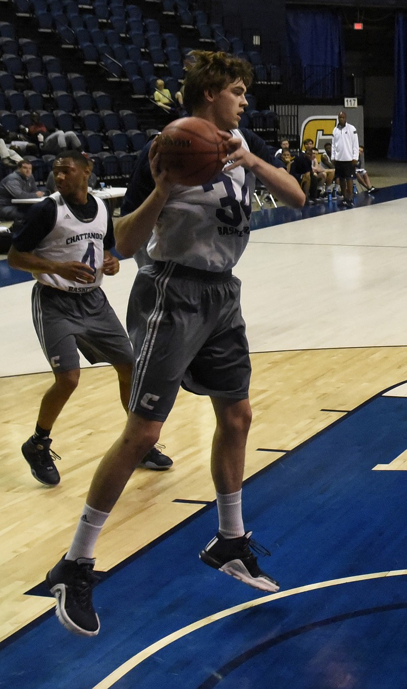 Jackson White brings down a rebound as the UTC men's basketball team holds a scrimmage at McKenzie Arena on Sunday, Oct. 18, 2015, in Chattanooga, Tenn.