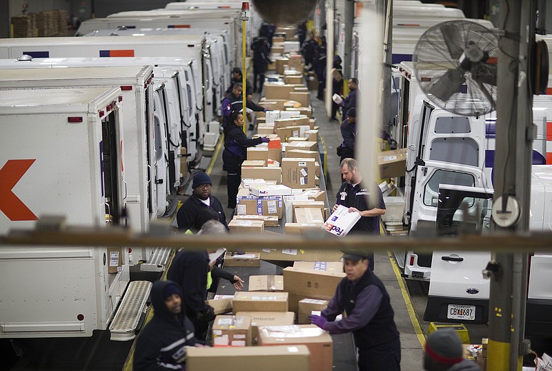 
              FILE - In this Dec. 14, 2014 file photo, packages are sorted on a conveyer belt before being loaded onto trucks for delivery at a FedEx facility in Marietta, Ga. FedEx on Monday, Oct. 26, 2015 predicted that shipments from Black Friday through Christmas Eve will rise 12.4 percent over last year to 317 million pieces. (AP Photo/David Goldman, File)
            