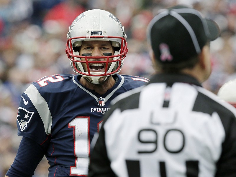 
              New England Patriots quarterback Tom Brady argues his point with line judge Mike Spanier (90) during the first half of an NFL football game against the New York Jets, Sunday, Oct. 25, 2015, in Foxborough, Mass. (AP Photo/Charles Krupa)
            